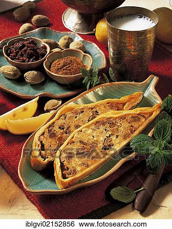 Stock Photograph - Moroccan chicken pie, spices, almonds, meat and raisins, Morocco, Africa. Fotosearch