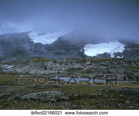 Stock Image - Mount Fannaraken, Fannaråken or Fannaråki with Fannarakbreen or Fannråkbreen Glacier, Sognefjell, Sogn og Fjordane, Norway, Scandinavia, Europe. Fotosearch