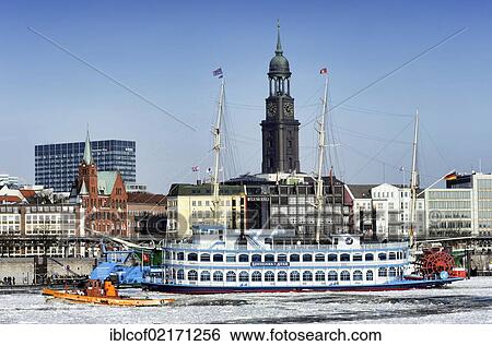 Stock Photograph - MS Louisiana Star, paddle wheel steamer, and icebreaker Hugo Lentz in the wintry Port of Hamburg, Hamburg, Germany, Europe. Fotosearch