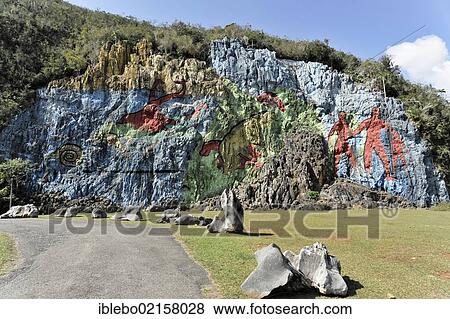 Stock Photo - Mural de la Prehistoria, prehistoric wall, painted in 1961 by Mexican artist Leovigildo González Morillo, size 120x180 meters, Vinales, UNESCO World Heritage Site, Province of Pinar del Rio, Cuba, Greater Antilles, Caribbean, Central America, America,.... Fotosearch