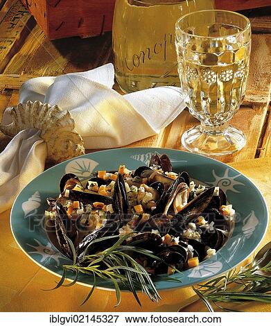 Stock Photo - Mussels in wine and mint sauce, hot starter, Great Britain. Fotosearch