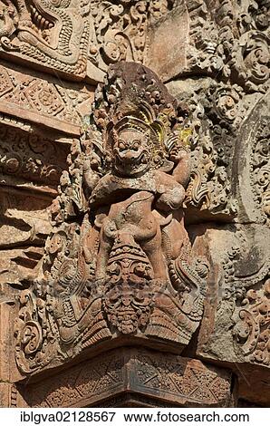 Mythological figure with a frightening face, guardian of the inner shrine, Banteay Srei temple, Citadel of Women, Angkor, Cambodia, Southeast Asia, Asia View Large Photo Image Stock Photo - Mythological figure with a frightening face, guardian of the inner shrine, Banteay Srei temple, Citadel of Women, Angkor, Cambodia, Southeast Asia, Asia. Fotosearch