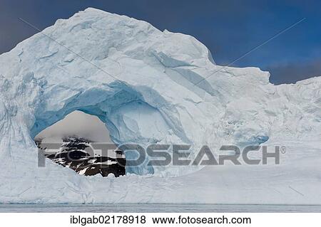 Natural arch carved in an iceberg, Antarctic Sound, Antarctic Peninsula, Antarctica View Large Photo Image Stock Photo - Natural arch carved in an iceberg, Antarctic Sound, Antarctic Peninsula, Antarctica. Fotosearch