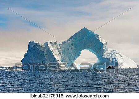 Natural arch carved in an iceberg, Antarctic Sound, Antarctic Peninsula, Antarctica View Large Photo Image Stock Photograph - Natural arch carved in an iceberg, Antarctic Sound, Antarctic Peninsula, Antarctica. Fotosearch