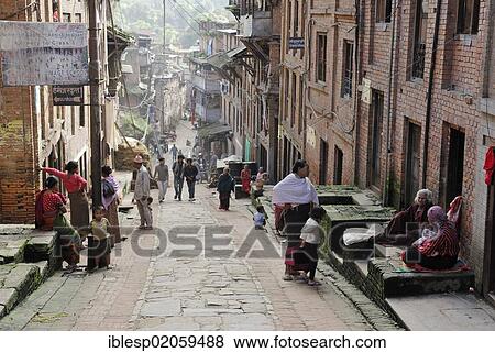 Nepalese people in traditional dress on historic street, Bhaktapur, Kathmandu Valley, Nepal, Asia View Large Photo Image Stock Photo - Nepalese people in traditional dress on historic street, Bhaktapur, Kathmandu Valley, Nepal, Asia. Fotosearch