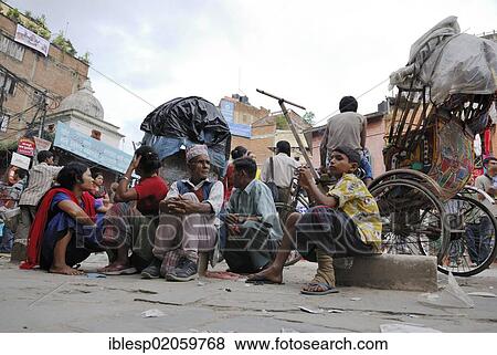 Stock Photo - Nepalese sitting in front of rickshaw, Kathmandu, Nepal, Asia. Fotosearch