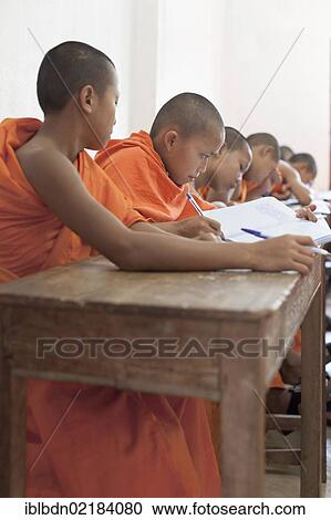 Novice monks in classroom at Wat Siphoutthabat school, Luang Prabang, Laos, Southeast Asia, Asia View Large Photo Image Stock Image - Novice monks in classroom at Wat Siphoutthabat school, Luang Prabang, Laos, Southeast Asia, Asia. Fotosearch