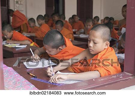 Novice monks in classroom at Wat Siphoutthabat school, Luang Prabang, Laos, Southeast Asia, Asia View Large Photo Image Stock Image - Novice monks in classroom at Wat Siphoutthabat school, Luang Prabang, Laos, Southeast Asia, Asia. Fotosearch