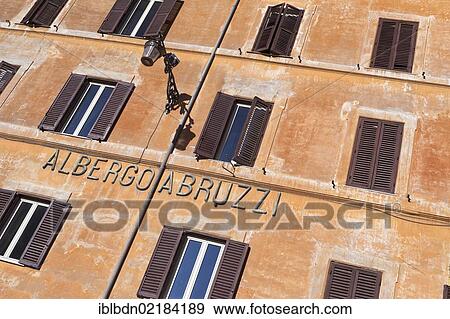 Stock Photo - Ocre wall with brown shutters, Albergo Abruzzi in the Piazza della Rotonda, Rome, Italy, Europe. Fotosearch