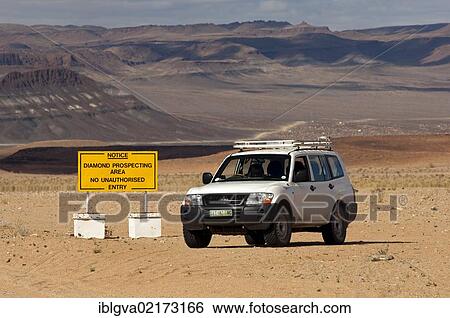 Off-road vehicle at the access point to a diamond mining zone in the border area between South Africa and Namibia, at back, Richtersveld National Park, Northern Cape Province, South Africa, Africa View Large Photo Image Stock Photograph - Off-road vehicle at the access point to a diamond mining zone in the border area between South Africa and Namibia, at back, Richtersveld National Park, Northern Cape Province, South Africa, Africa. Fotosearch