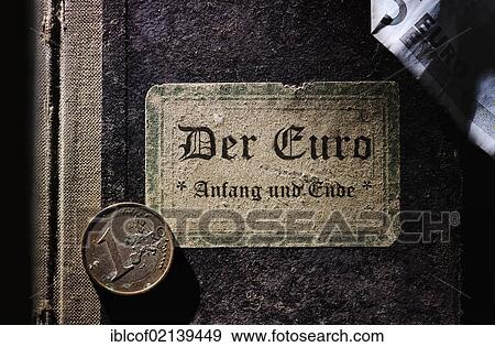 Stock Photo - Old book with the inscription, Der Euro – Anfang und Ende, German for The euro – the beginning and the end, symbolic image for the euro crisis. Fotosearch