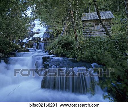 Stock Image - Old Cabin at Tvindevoss Waterfall near Voss, Hordaland, Norway, Scandinavia, Europe. Fotosearch