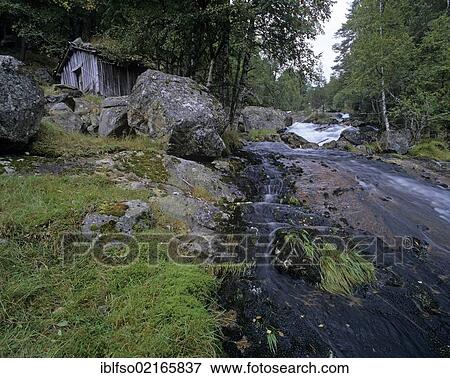 Stock Photo - Old cabin beside a mountain river in Setesdal valley, Norway, Scandinavia, Europe. Fotosearch