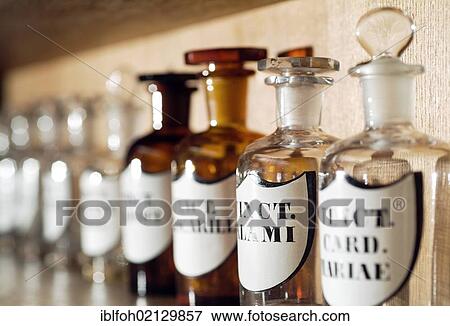 Old glass bottles for medicinal ingredients in a pharmacy, Dortmund, North Rhine-Westphalia, Germany, Europe View Large Photo Image Stock Photo - Old glass bottles for medicinal ingredients in a pharmacy, Dortmund, North Rhine-Westphalia, Germany, Europe. Fotosearch
