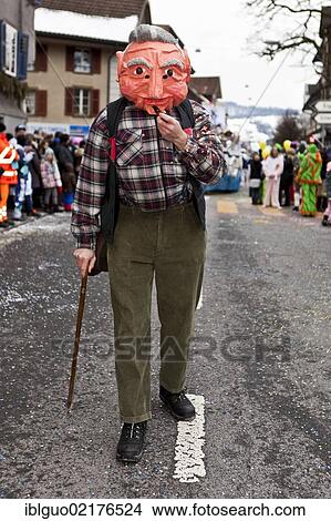 Old man walking on a stick, costume, 35th Motteri parade in Malters, Lucerne, Switzerland, Europe View Large Photo Image Picture - Old man walking on a stick, costume, 35th Motteri parade in Malters, Lucerne, Switzerland, Europe. Fotosearch