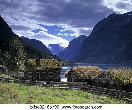 Old Wooden Huts Or Cabins On Lake Lovatnet Near Olden Sogn Og