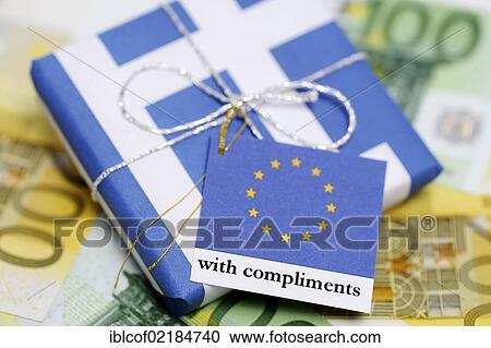 Stock Image - Package wrapped in a Greek flag with a greeting card from the EU, symbolic image of the aid package for Greece. Fotosearch