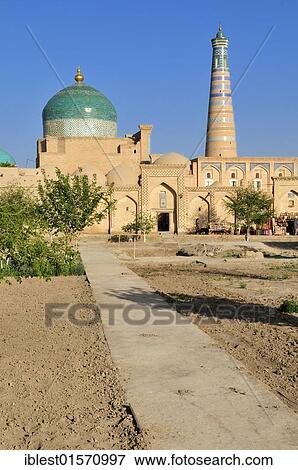 Pahlavan Mahmud Complex and Islam Khodja or Islom Xoja Minaret in the historic adobe town of Khiva, Chiva, Ichan Kala, Silk Road, Unesco World Heritage Site, Uzbekistan, Central Asia, Asia View Large Photo Image Stock Photo - Pahlavan Mahmud Complex and Islam Khodja or Islom Xoja Minaret in the historic adobe town of Khiva, Chiva, Ichan Kala, Silk Road, Unesco World Heritage Site, Uzbekistan, Central Asia, Asia. Fotosearch