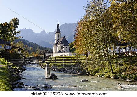 Parish Church of St. Sebastian and Ramsauer Ache River in front of the Reiteralpe mountains, Berchtesgadener Land, Upper Bavaria, Germany, Europe View Large Photo Image Stock Image - Parish Church of St. Sebastian and Ramsauer Ache River in front of the Reiteralpe mountains, Berchtesgadener Land, Upper Bavaria, Germany, Europe. Fotosearch