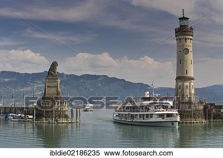 Stock Photography - Passenger ships approaching the harbour, lighthouse, Lindau, Lake Constance, Baden-Wuerttemberg, southern Germany, Germany, Europe. Fotosearch