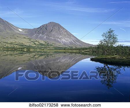 Peaks of the Stygghøin, Stygghoin mountain range, reflected in the Dørålstjørnin, Doralstjornin Lake, Rondane National Park, Norway, Scandinavia, Europe View Large Photo Image Stock Photo - Peaks of the Stygghøin, Stygghoin mountain range, reflected in the Dørålstjørnin, Doralstjornin Lake, Rondane National Park, Norway, Scandinavia, Europe. Fotosearch