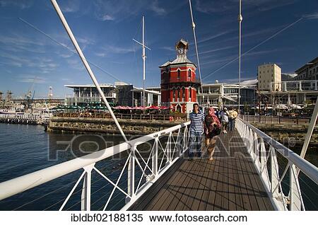 People crossing a swing bridge, Nelson Mandela Gateway, Clock Tower, Victoria & Alfred Waterfront, Cape Town, Western Cape, South Africa, Africa View Large Photo Image Stock Photography - People crossing a swing bridge, Nelson Mandela Gateway, Clock Tower, Victoria & Alfred Waterfront, Cape Town, Western Cape, South Africa, Africa. Fotosearch
