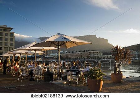 People in street cafes, Table Mountain, Victoria & Alfred Waterfront, Cape Town, Western Cape, South Africa, Africa View Large Photo Image Stock Photo - People in street cafes, Table Mountain, Victoria & Alfred Waterfront, Cape Town, Western Cape, South Africa, Africa. Fotosearch