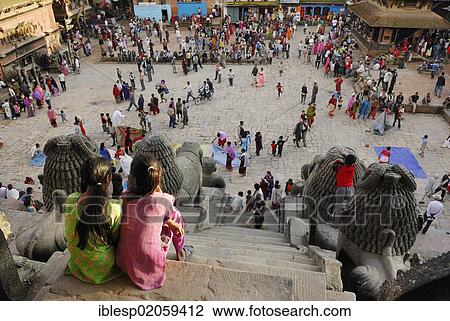 Stock Image - People, Nyatapola Pagoda, Taumadhi Square, Bhaktapur, Kathmandu Valley, Nepal, Asia. Fotosearch
