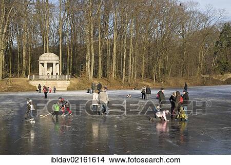 People on the frozen lake in "Stadtwald" park, Krefeld, North Rhine-Westphalia, Germany, Europe View Large Photo Image Picture - People on the frozen lake in "Stadtwald" park, Krefeld, North Rhine-Westphalia, Germany, Europe. Fotosearch