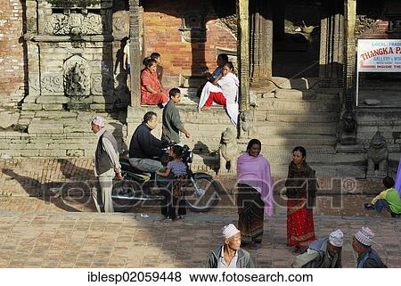 Stock Photo - People on the Taumadhi square, Bhaktapur, Kathmandu Valley, Nepal, Asia. Fotosearch