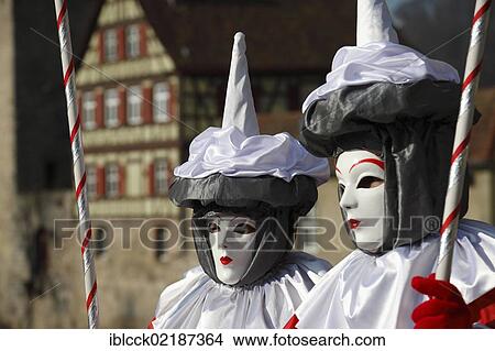 Picture - People wearing masks, bank of the Kocher River at the back, Hallia Venezia carnival, Schwaebisch Hall, Baden-Wuerttemberg, Germany, Europe. Fotosearch