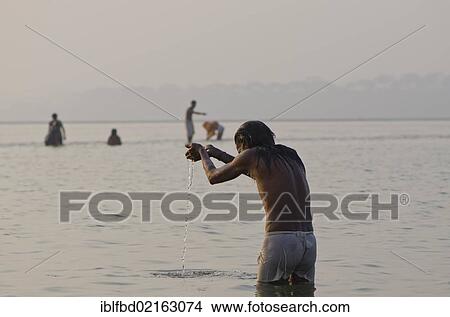 Pilgrim praying at Sangam, the confluence of the holy rivers Ganges, Yamuna and Saraswati, in Allahabad, Uttar Pradesh, India, Asia View Large Photo Image Picture - Pilgrim praying at Sangam, the confluence of the holy rivers Ganges, Yamuna and Saraswati, in Allahabad, Uttar Pradesh, India, Asia. Fotosearch