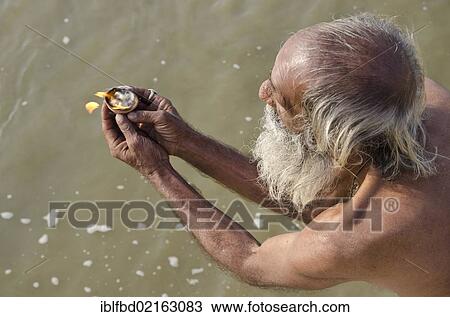 Pilgrim praying at Sangam, the confluence of the holy rivers Ganges, Yamuna and Saraswati, in Allahabad, Uttar Pradesh, India, Asia View Large Photo Image Stock Image - Pilgrim praying at Sangam, the confluence of the holy rivers Ganges, Yamuna and Saraswati, in Allahabad, Uttar Pradesh, India, Asia. Fotosearch