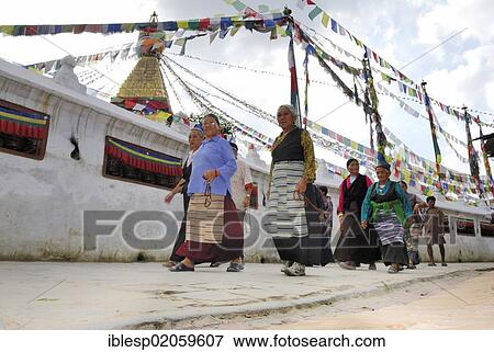 Pilgrims walking around stupa of Boudhanath, Kathmandu, Nepal, Asia View Large Photo Image Stock Photo - Pilgrims walking around stupa of Boudhanath, Kathmandu, Nepal, Asia. Fotosearch