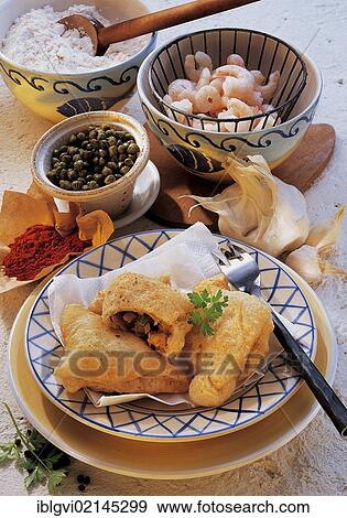 Portuguese shrimp turnovers, thin yeast dough filled with shrimps, served freshly from the oven, warm starter, Portugal, Europe View Large Photo Image Stock Photo - Portuguese shrimp turnovers, thin yeast dough filled with shrimps, served freshly from the oven, warm starter, Portugal, Europe. Fotosearch
