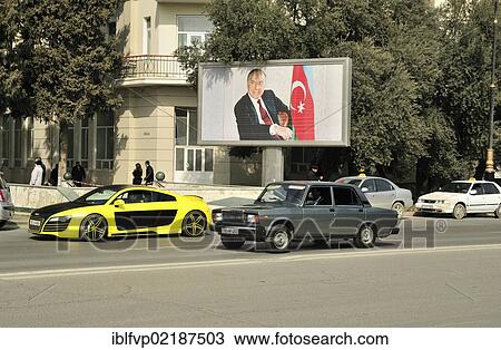 Stock Image - Poster with an image of Heydar Aliyev, 1923 - 2003, from 1993 to 2003 President of the Republic of Azerbaijan and Azerbaijani Dynast, on the beach promenade, Bulevar, Baku, Azerbaijan, Caucasus, Middle East, Asia. Fotosearch