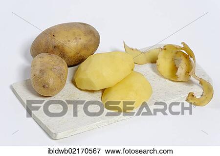 Potato peeling, peeled raw potatoes View Large Photo Image Stock Photo - Potato peeling, peeled raw potatoes. Fotosearch