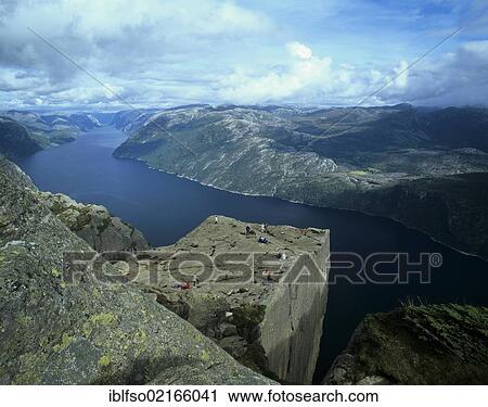 Stock Image - Preikestolen, Preacher's Pulpit or Pulpit Rock, with tourists, at Lysefjorden or Lysefjord, Rogaland, Norway, Scandinavia, Europe. Fotosearch