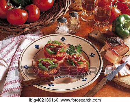 Stock Image - Puszta tomatoes with bacon, green peppers and vegetables, Hungary, Europe. Fotosearch
