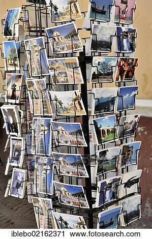 Rack with postcards, souvenirs, Trinidad, Sancti Spiritus Province, Cuba, Greater Antilles, Central America, America, North America View Large Photo Image Stock Image - Rack with postcards, souvenirs, Trinidad, Sancti Spiritus Province, Cuba, Greater Antilles, Central America, America, North America. Fotosearch