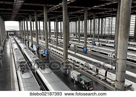 Stock Image - Railway tracks and trains, Atocha station, Madrid, Spain, Europe. Fotosearch