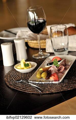 Red wine and appetisers in the restaurant of the Nyungwe Forest Lodge, Nyungwe National Park, Rwanda, Africa View Large Photo Image Stock Image - Red wine and appetisers in the restaurant of the Nyungwe Forest Lodge, Nyungwe National Park, Rwanda, Africa. Fotosearch