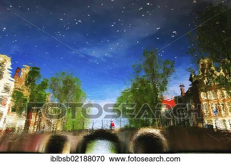 Reflection of buildings in a canal, Amsterdam, Holland, Netherlands, Europe View Large Photo Image Stock Image - Reflection of buildings in a canal, Amsterdam, Holland, Netherlands, Europe. Fotosearch