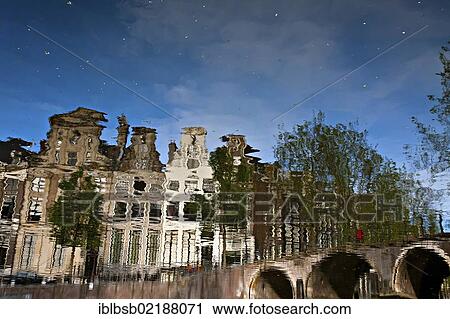 Reflection of buildings in a canal, Amsterdam, Holland, Netherlands, Europe View Large Photo Image Stock Image - Reflection of buildings in a canal, Amsterdam, Holland, Netherlands, Europe. Fotosearch