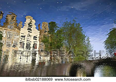 Reflection of buildings in a canal, Amsterdam, Holland, Netherlands, Europe View Large Photo Image Stock Photo - Reflection of buildings in a canal, Amsterdam, Holland, Netherlands, Europe. Fotosearch