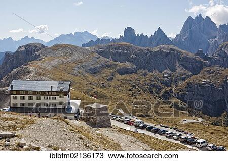 Refugio Auronzo, Tre Cime di Lavaredo or Drei Zinnen peaks, Gruppo dei Cadini or Cadini group at back, Dolomites, Italy, Europe View Large Photo Image Stock Image - Refugio Auronzo, Tre Cime di Lavaredo or Drei Zinnen peaks, Gruppo dei Cadini or Cadini group at back, Dolomites, Italy, Europe. Fotosearch