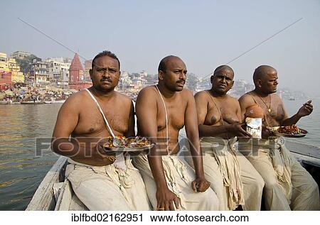 Remains of the cremation of a family member getting offered to the holy river Ganges, Varanasi, Uttar Pradesh, India, Asia View Large Photo Image Stock Image - Remains of the cremation of a family member getting offered to the holy river Ganges, Varanasi, Uttar Pradesh, India, Asia. Fotosearch