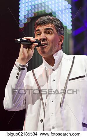 Renato Wohllaib of the Austrian pop band "Die Paldauer" performing live at the Schlager Nacht 2012, pop music event, in Lucerne, Switzerland, Europe View Large Photo Image Picture - Renato Wohllaib of the Austrian pop band "Die Paldauer" performing live at the Schlager Nacht 2012, pop music event, in Lucerne, Switzerland, Europe. Fotosearch