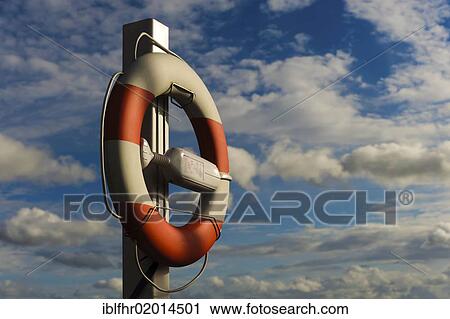 Stock Image - Ring buoy against clouds in the sky. Fotosearch