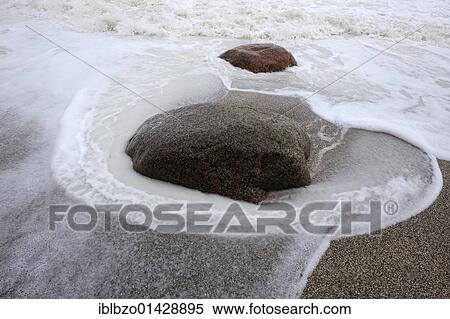Rising waves wash around a stone, stormy weather, Baltic Sea, Moen Island, Denmark, Scandinavia, Europe View Large Photo Image Stock Photography - Rising waves wash around a stone, stormy weather, Baltic Sea, Moen Island, Denmark, Scandinavia, Europe. Fotosearch